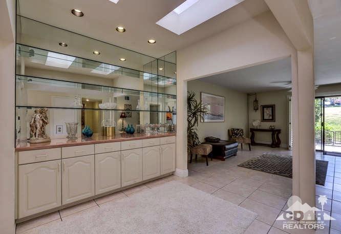 72399 Ridgecrest Lane Palm Desert, CA 92260 - Photo 11 of 34 a room with lot of cabinets and couch