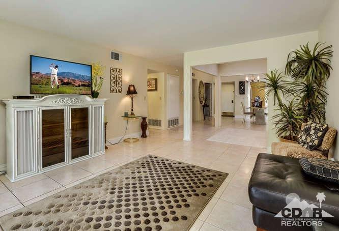 72399 Ridgecrest Lane Palm Desert, CA 92260 - Photo 14 of 34 a living room with furniture and a flat screen tv