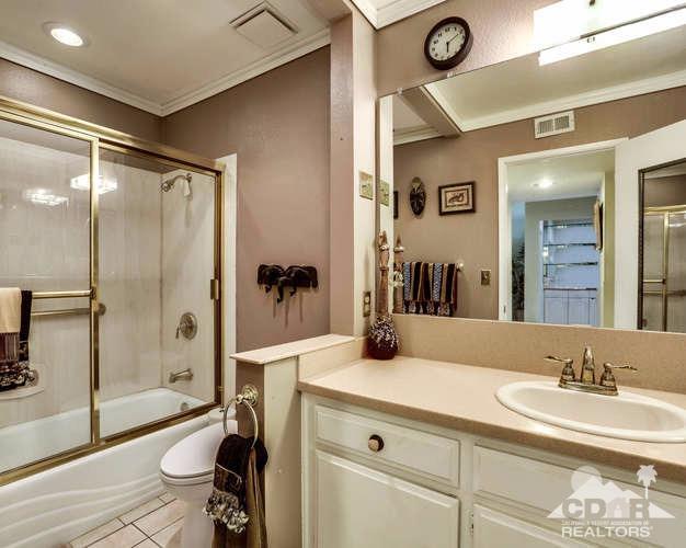 72399 Ridgecrest Lane Palm Desert, CA 92260 - Photo 22 of 34 a bathroom with a sink and a mirror