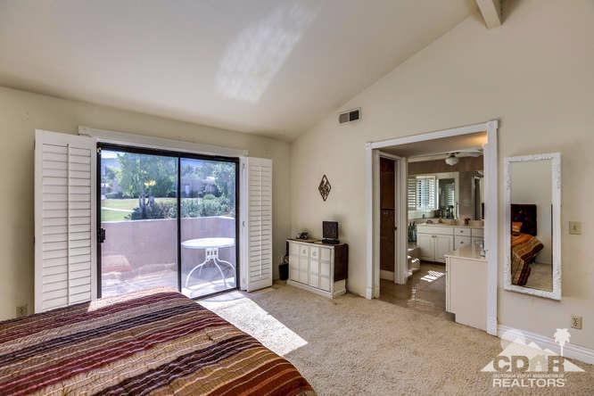 72399 Ridgecrest Lane Palm Desert, CA 92260 - Photo 24 of 34 a bedroom with a bed and a large window