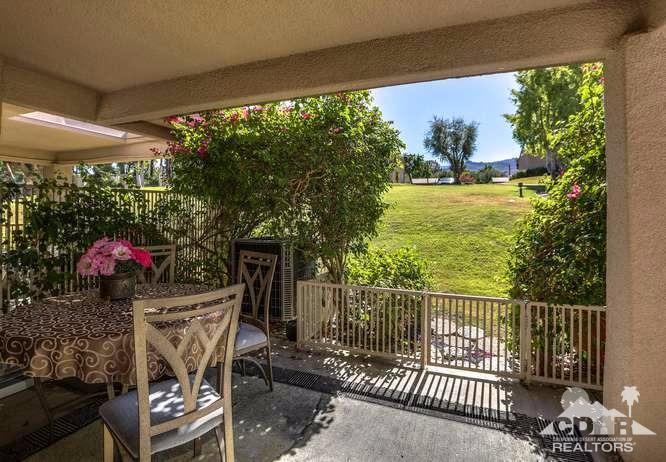 72399 Ridgecrest Lane Palm Desert, CA 92260 - Photo 29 of 34 a view of a chairs and table in patio