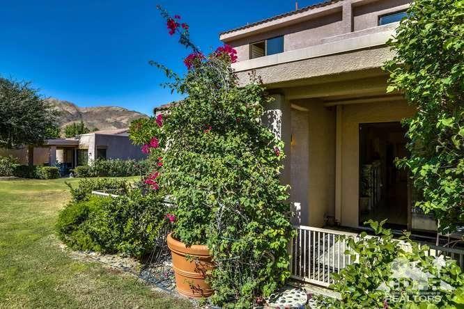 72399 Ridgecrest Lane Palm Desert, CA 92260 - Photo 32 of 34 a front view of a house with a yard