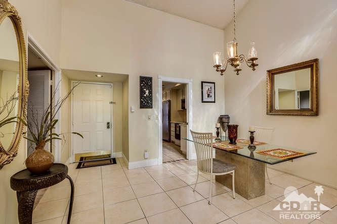 72399 Ridgecrest Lane Palm Desert, CA 92260 - Photo 8 of 34 a living room with furniture a chandelier and a dining table