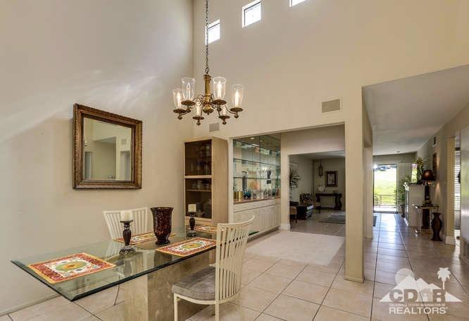72399 Ridgecrest Lane Palm Desert, CA 92260 - Photo 9 of 34 a view of a livingroom with furniture and kitchen view
