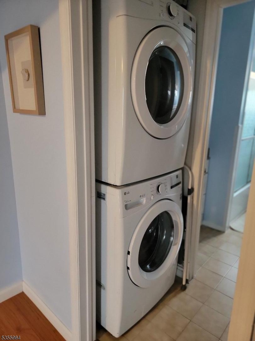 63 Rome Street Newark, NJ 07105 - Photo 11 of 11 a utility room with dryer and washer