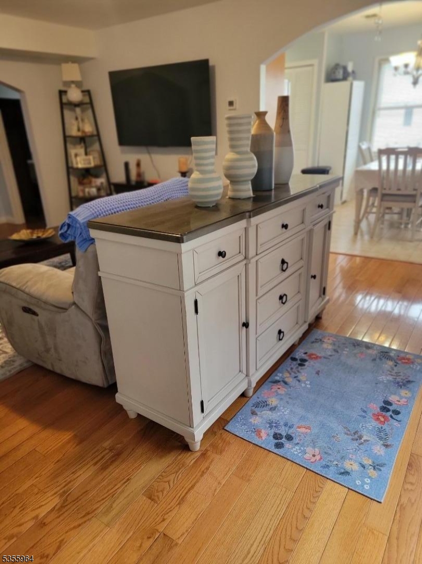 63 Rome Street Newark, NJ 07105 - Photo 3 of 11 a room with cabinets and flat screen tv