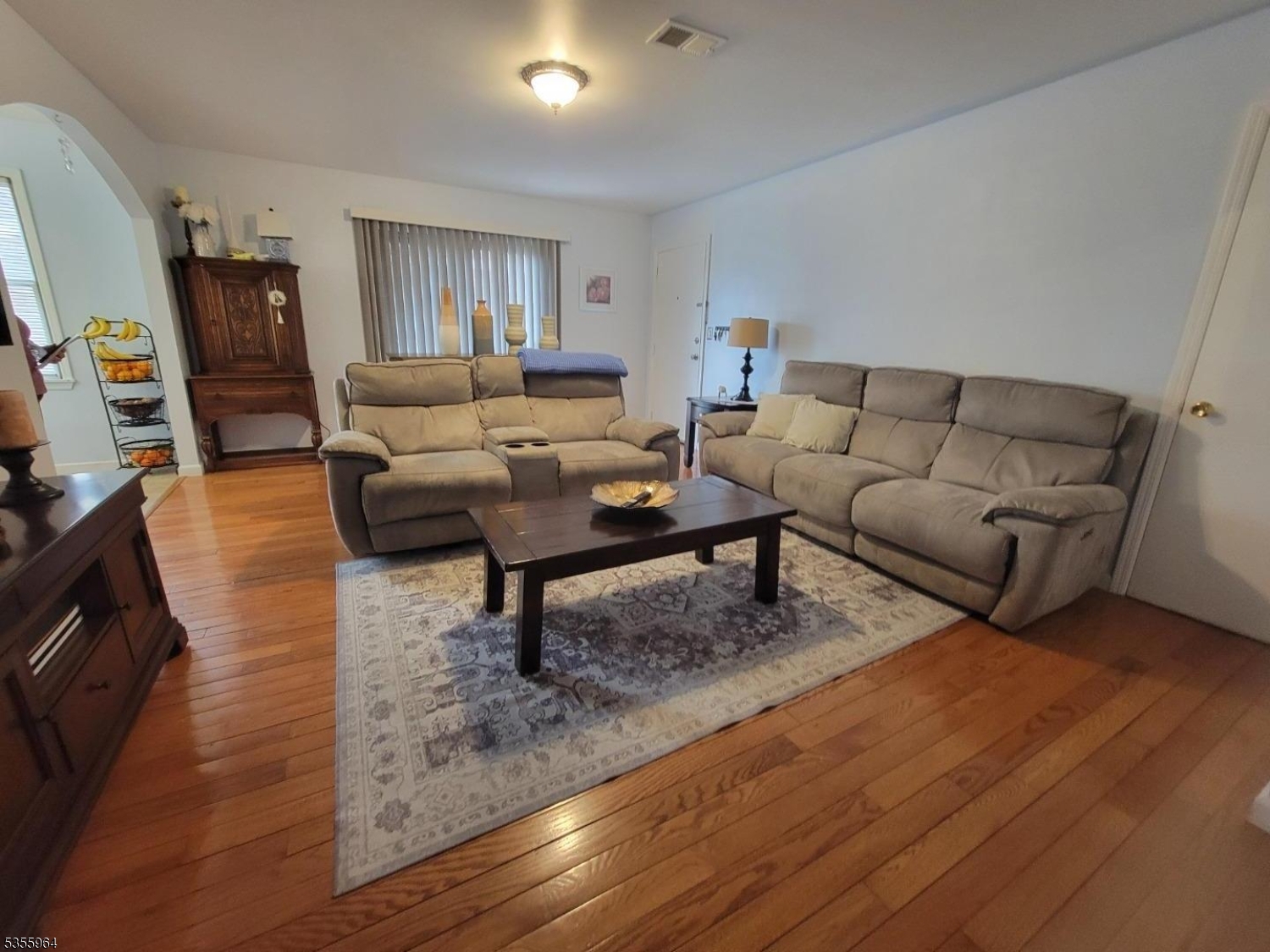 63 Rome Street Newark, NJ 07105 - Photo 4 of 11 a living room with furniture and a rug