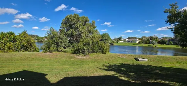a view of a lake with a big yard