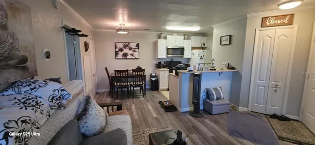 a view of a livingroom with furniture and wooden floor