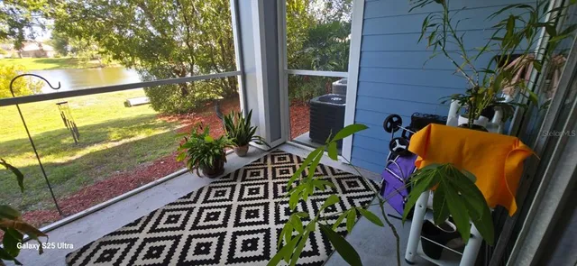 a view of balcony with chairs and wooden fence