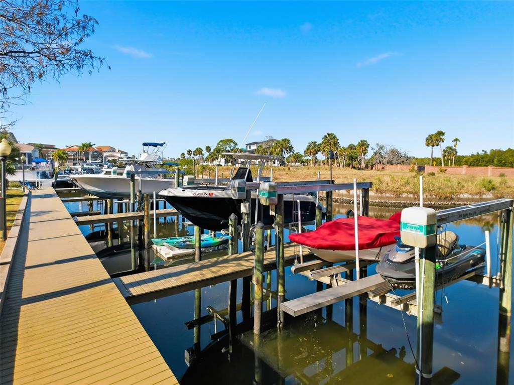 4536 Heron Landing New Port Richey, FL 34652 - Photo 49 of 70 a view of a balcony with wooden floor and outdoor space