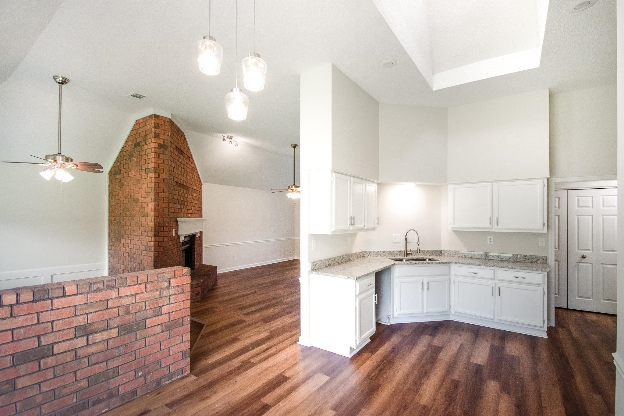6756 Martha's Point Memphis, TN 38141 - Photo 3 of 15 a large kitchen with kitchen island a sink stainless steel appliances and cabinets