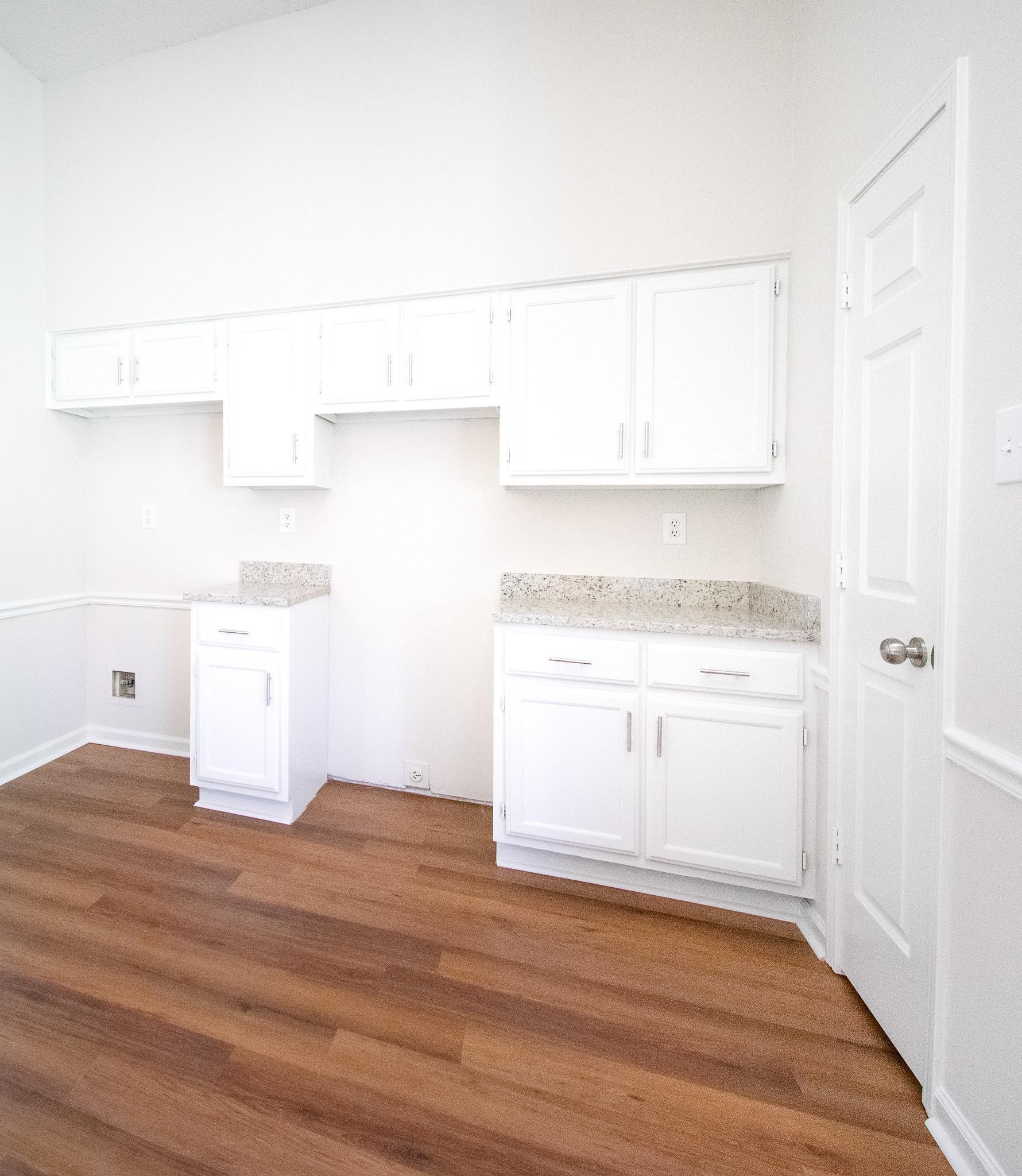 6756 Martha's Point Memphis, TN 38141 - Photo 5 of 15 a view of a kitchen with white cabinets and a stove