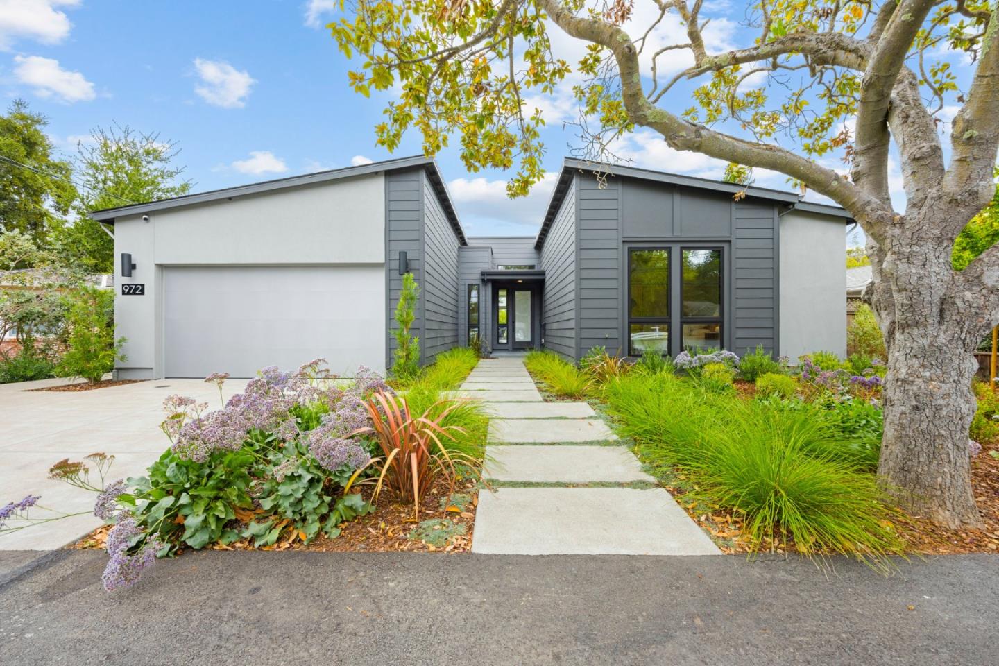 972 Olive Street Menlo Park, CA 94025 - Photo 1 of 1 a front view of a house with a yard