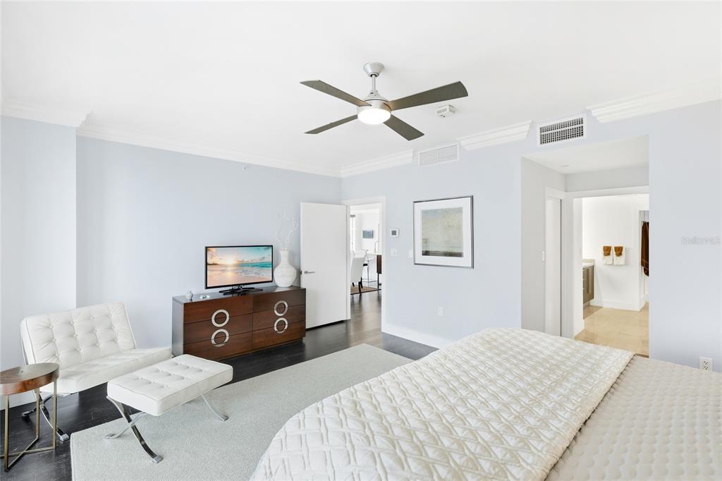 455 Longboat Club Road, Unit 408 Longboat Key, FL 34228 - Photo 14 of 58 a bedroom with a bed and wooden floor