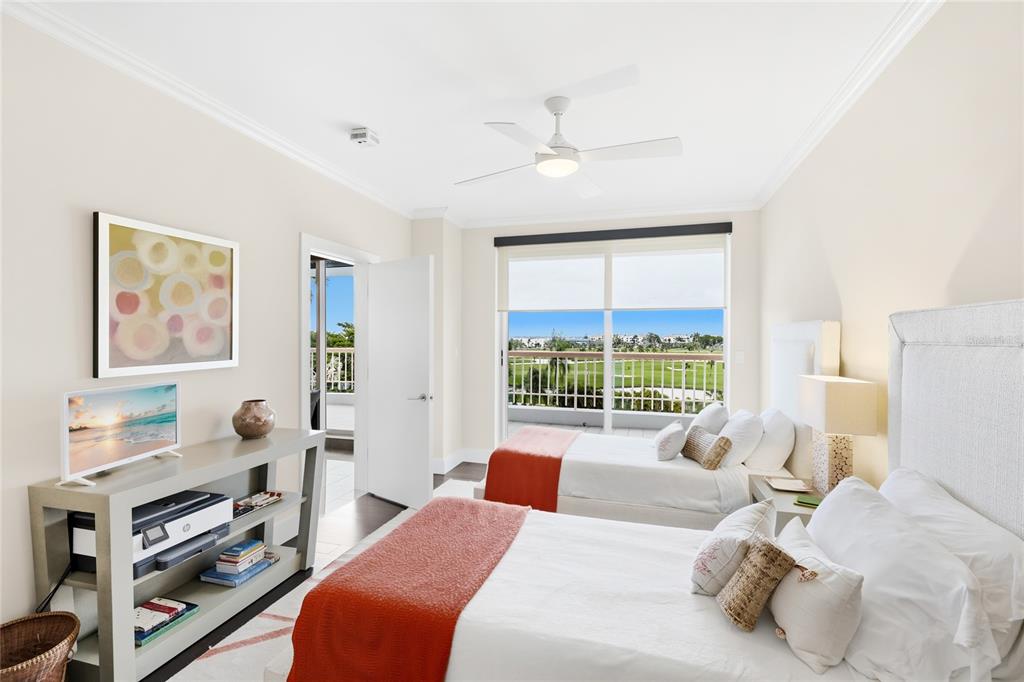 455 Longboat Club Road, Unit 408 Longboat Key, FL 34228 - Photo 18 of 58 a bedroom with a bed and a large window