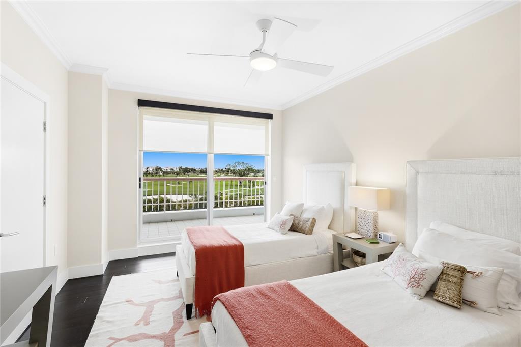 455 Longboat Club Road, Unit 408 Longboat Key, FL 34228 - Photo 19 of 58 a bedroom with two beds and a large window