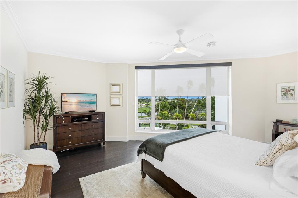 455 Longboat Club Road, Unit 408 Longboat Key, FL 34228 - Photo 23 of 58 a bedroom with a bed and a large window