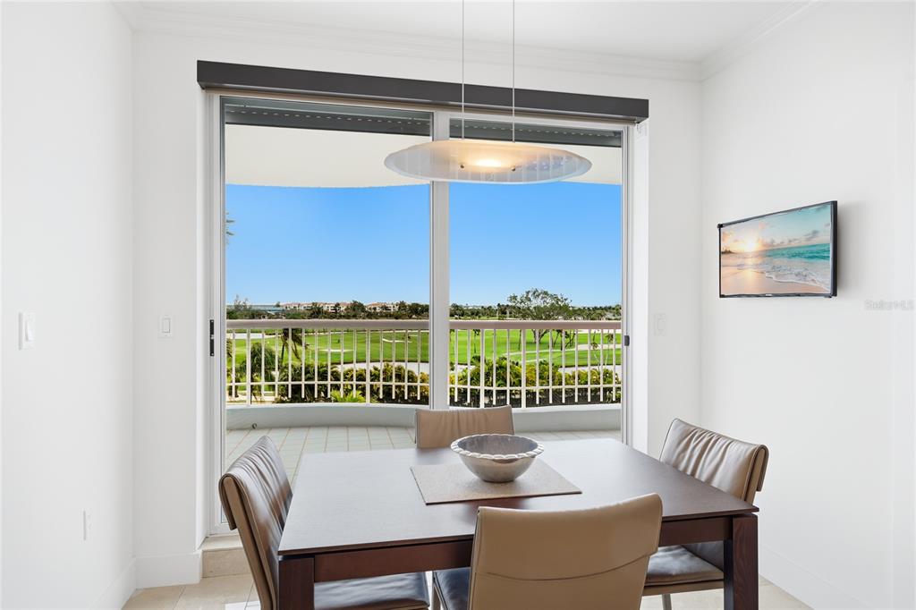455 Longboat Club Road, Unit 408 Longboat Key, FL 34228 - Photo 6 of 58 a dining room with furniture and a window
