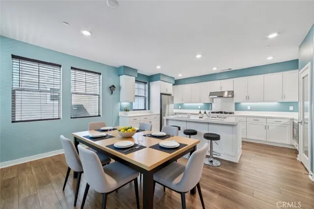 a kitchen with a table and chairs in it