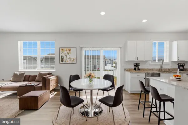 a kitchen with a refrigerator stove microwave and sink