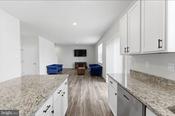 a room with a bed and a dresser