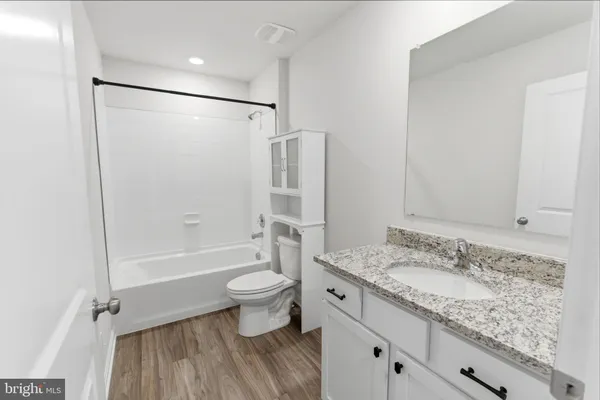 a living room with furniture couches and a flat screen tv