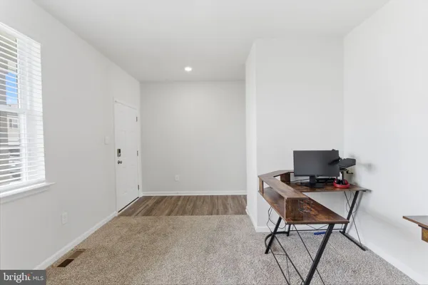 a bathroom with a toilet a sink and a mirror