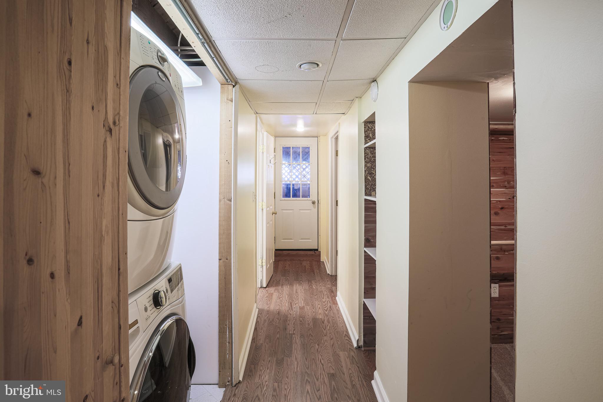 200 Stanmore Road Baltimore, MD 21212 - Photo 22 of 27 a view of a storage and utility room with washer and dryer