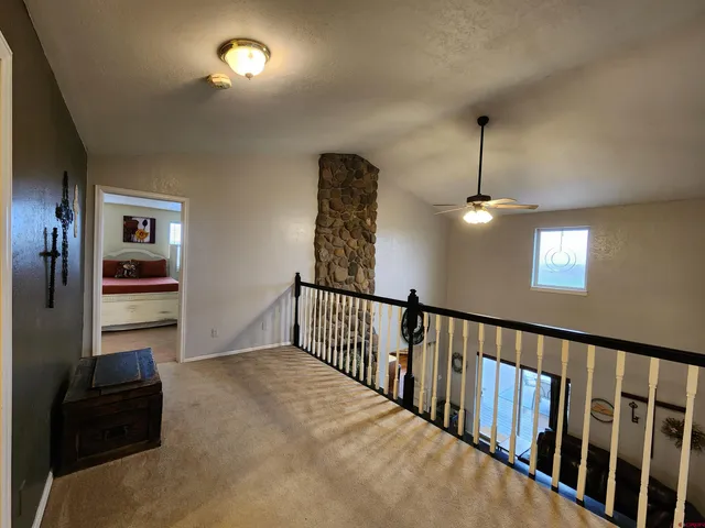 a view of hallway with livingroom