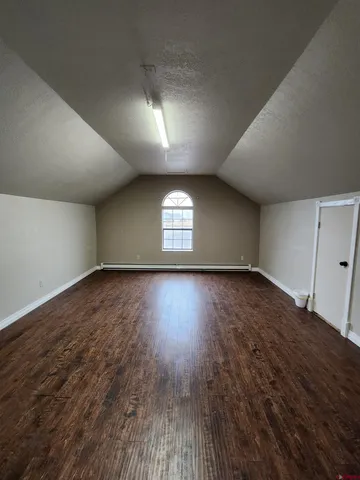 a bathroom with a toilet and a mirror