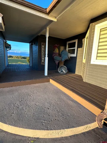 a view of an empty room and wooden floor