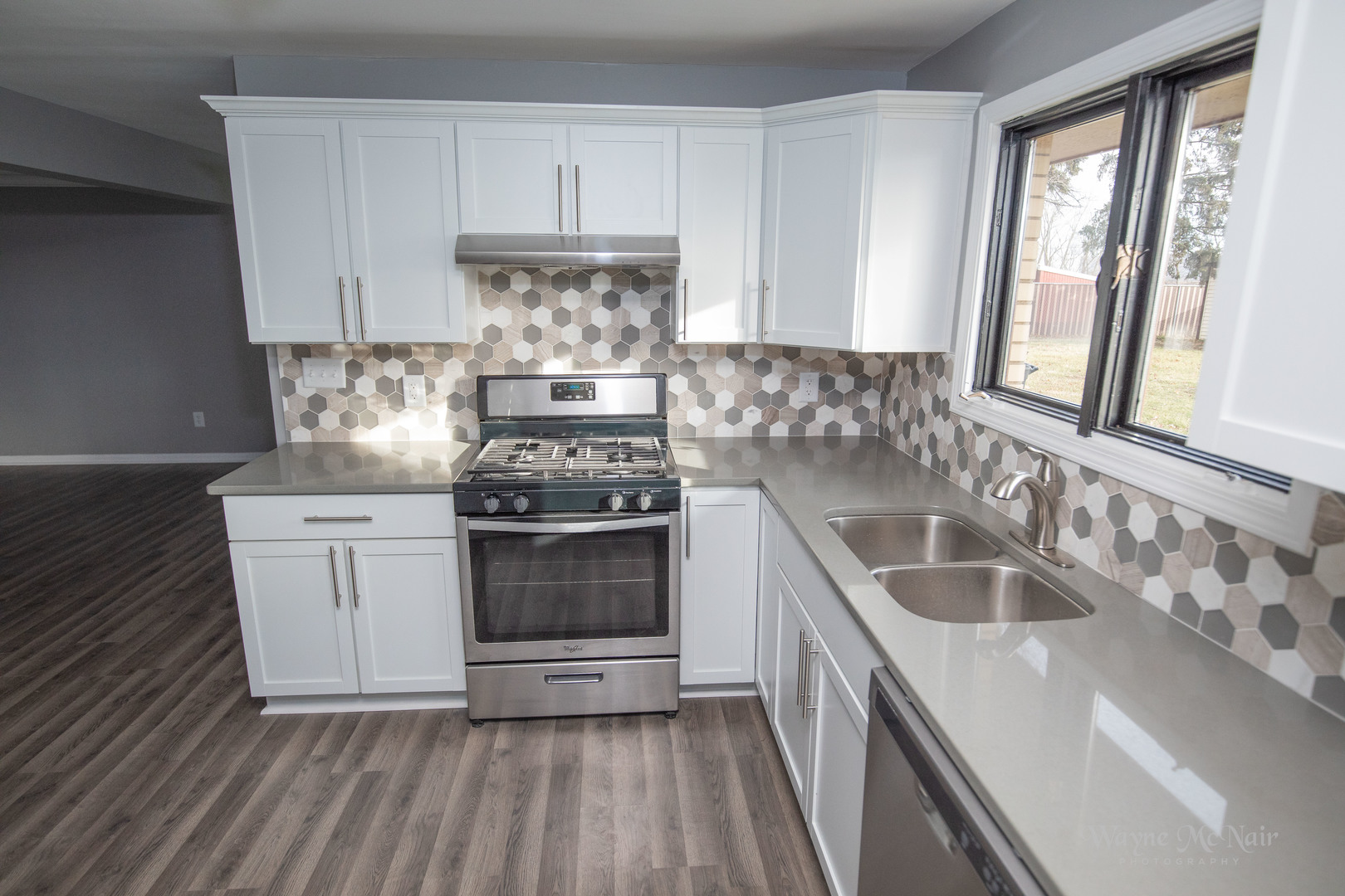 408 Hillside Road Joliet, IL 60433 - Photo 4 of 14 a kitchen with a stove a sink and a refrigerator