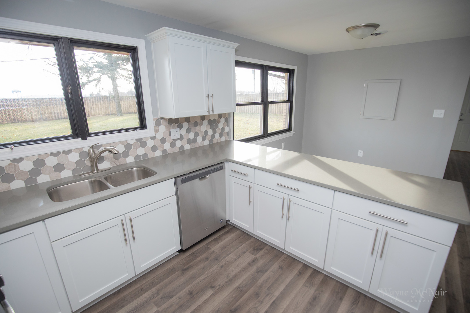408 Hillside Road Joliet, IL 60433 - Photo 6 of 14 a bathroom with a granite countertop sink mirror and a window