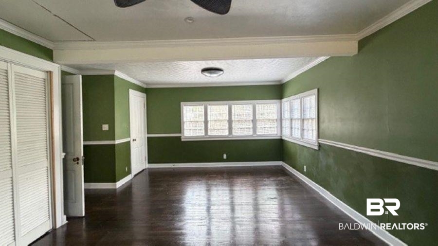3006 Pleasant Valley Road Mobile, AL 36606 - Photo 13 of 20 Unfurnished room featuring dark wood-style flooring, a ceiling fan, and ornamental molding