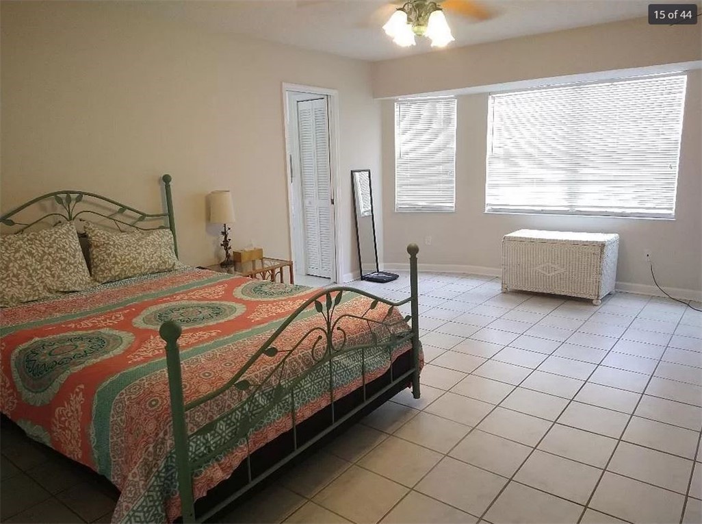 401 Coply Terrace Sebastian, FL 32958 - Photo 19 of 36 a bedroom with a bed and a window