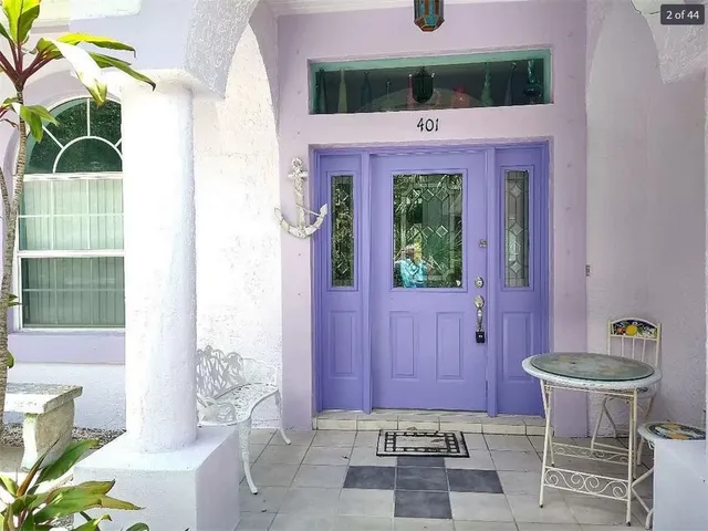 a front view of a house with outdoor seating