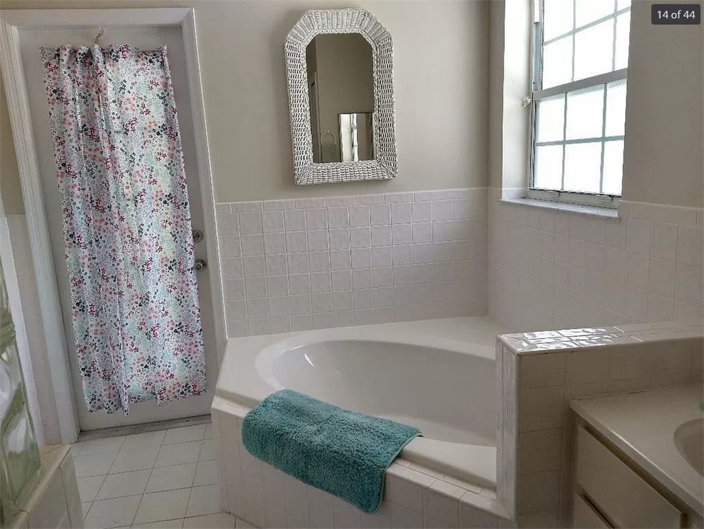 401 Coply Terrace Sebastian, FL 32958 - Photo 22 of 36 a bathroom with a bathtub and shower
