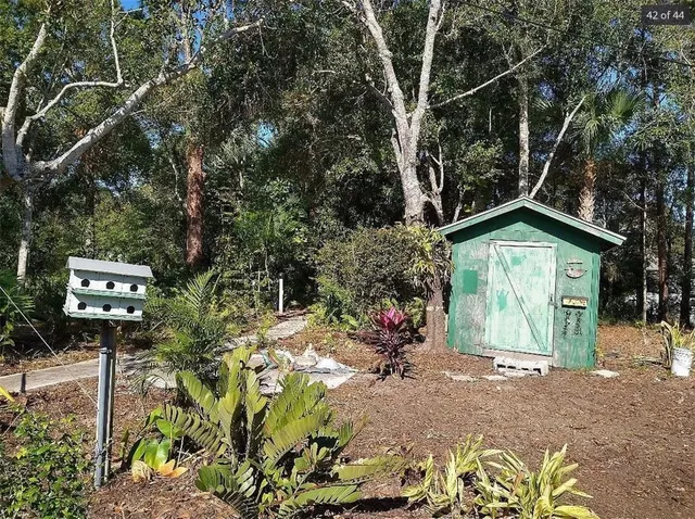 a view of a garden with a house
