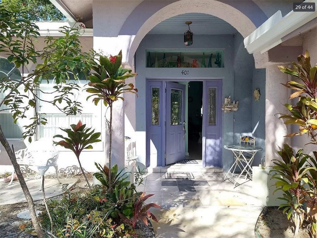 401 Coply Terrace Sebastian, FL 32958 - Photo 3 of 36 a front view of a house with garden