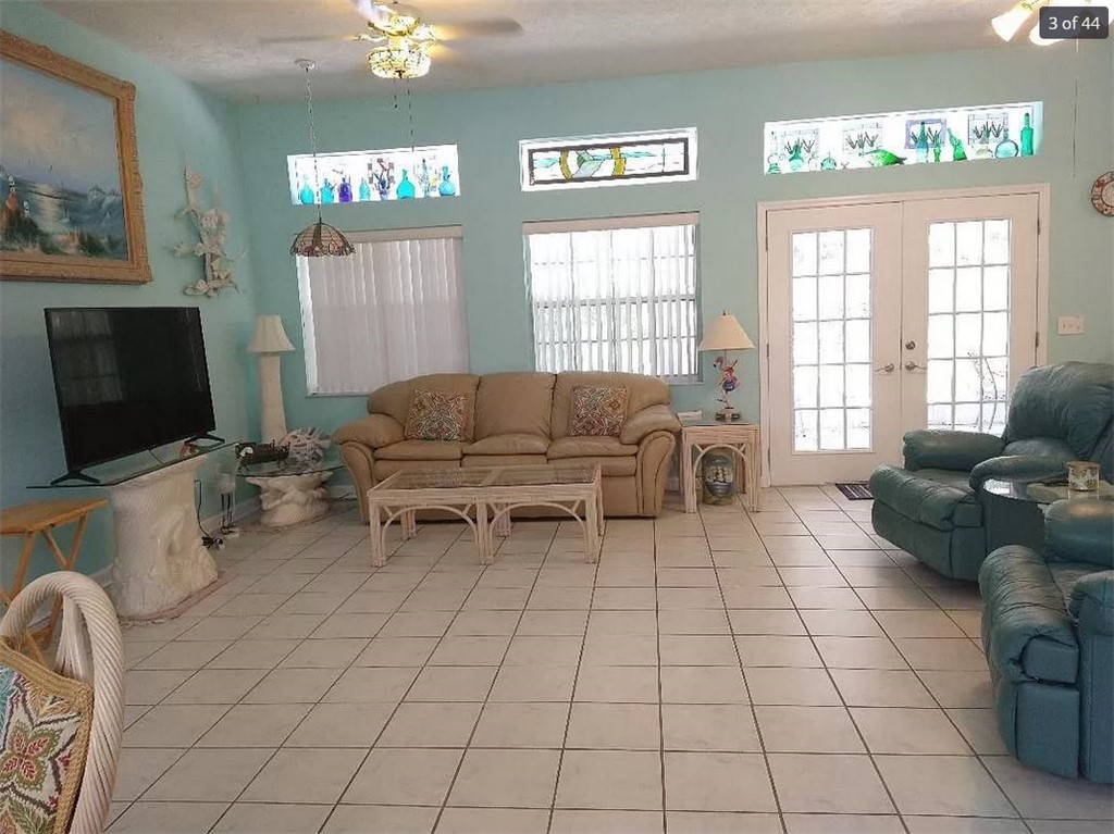 401 Coply Terrace Sebastian, FL 32958 - Photo 4 of 36 a living room with furniture and a flat screen tv
