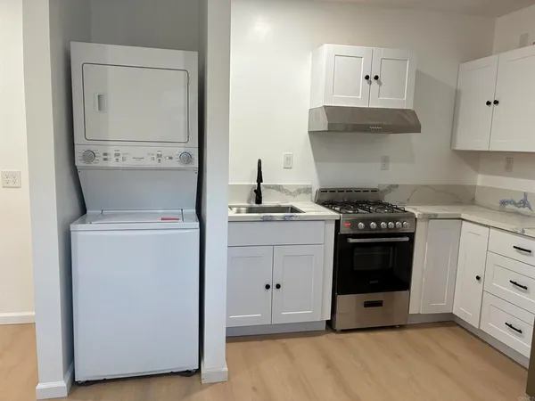 a kitchen with cabinets and appliances