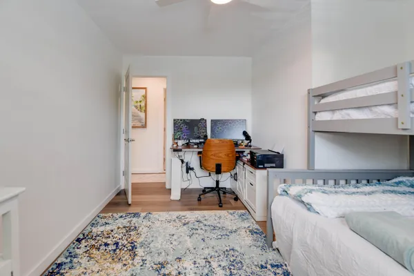 a bedroom with furniture and a window