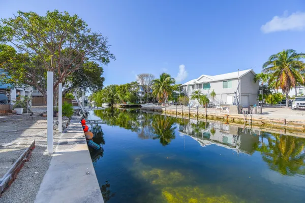 a view of swimming pool with outdoor seating