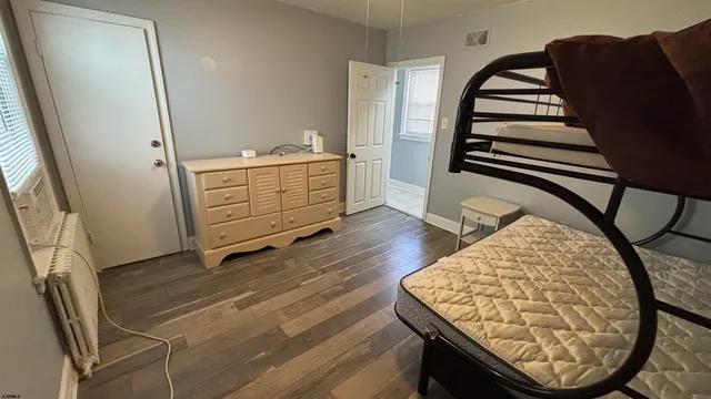 a view of a hardwood floor and staircase