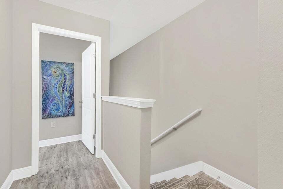 89 Crossing Lane, Unit F Santa Rosa Beach, FL 32459 - Photo 11 of 30 a view of a hallway with wooden floor and entryway
