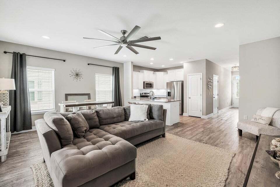 89 Crossing Lane, Unit F Santa Rosa Beach, FL 32459 - Photo 3 of 30 a living room with furniture white walls and white walls