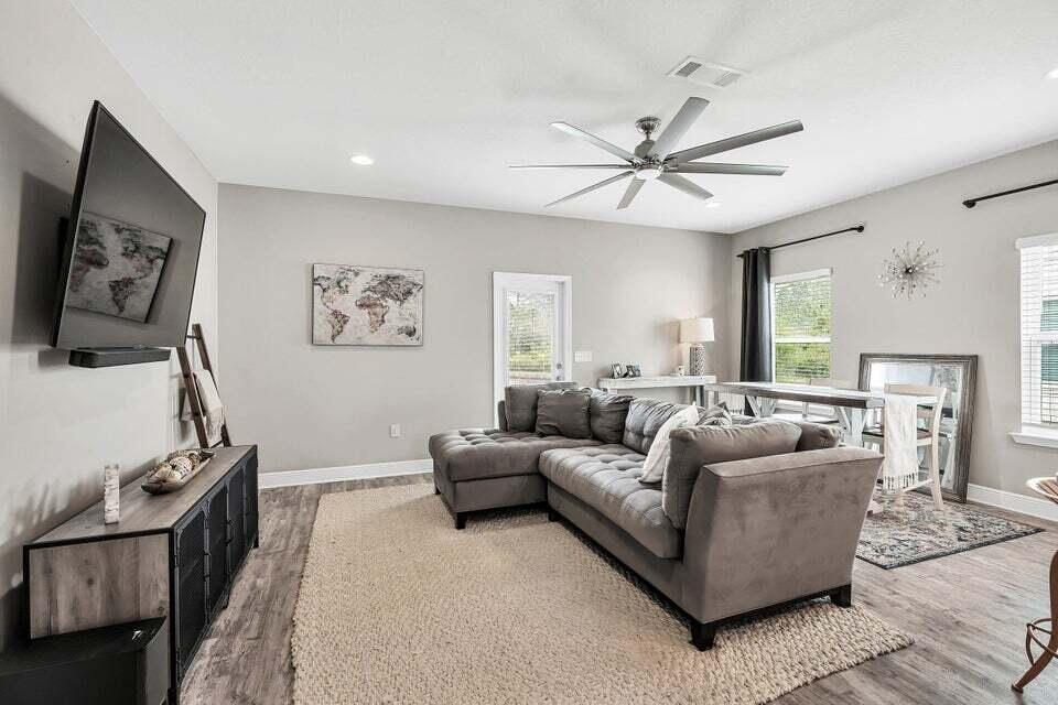 89 Crossing Lane, Unit F Santa Rosa Beach, FL 32459 - Photo 8 of 30 a living room with furniture and a flat screen tv