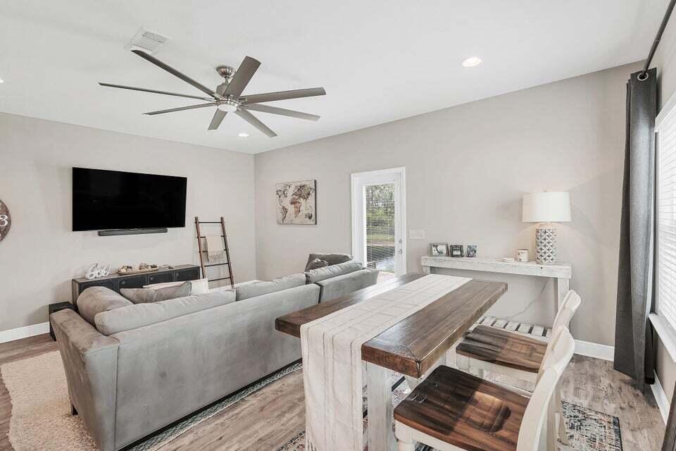 89 Crossing Lane, Unit F Santa Rosa Beach, FL 32459 - Photo 9 of 30 a living room with furniture and a flat screen tv