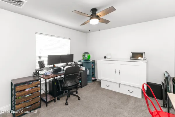 a view of a workspace with furniture